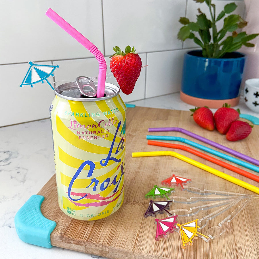 Cocktail umbrella drink markers for canned drinks Swizzly Sticks paired with bendy paper straws all from The Pursuit of Cocktails