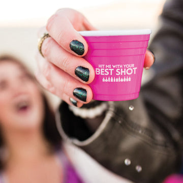 Hot pink plastic shot glass with funny saying 
